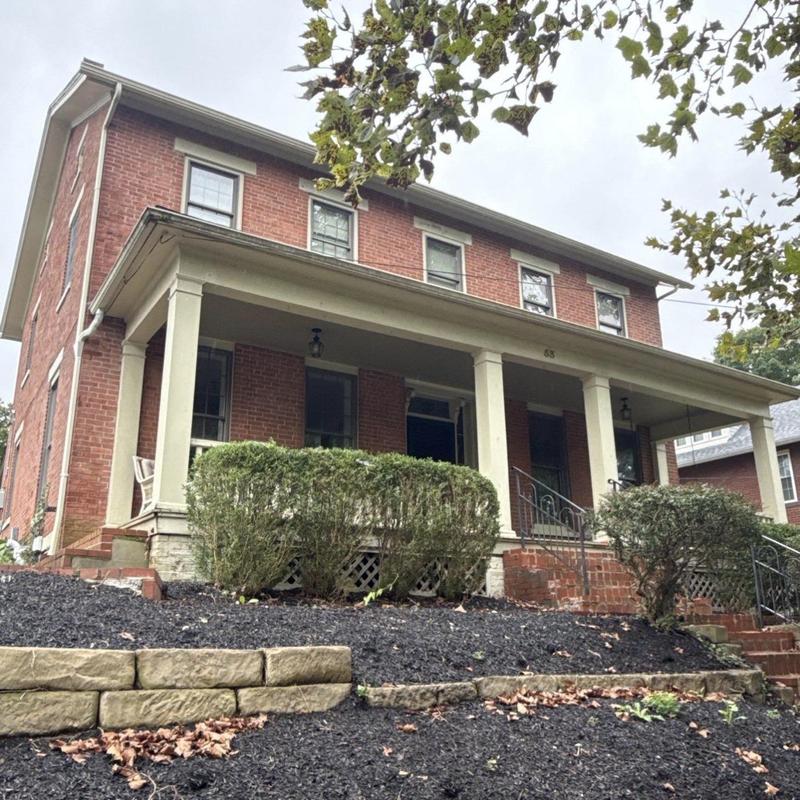Seamless gutter system on two-story brick house