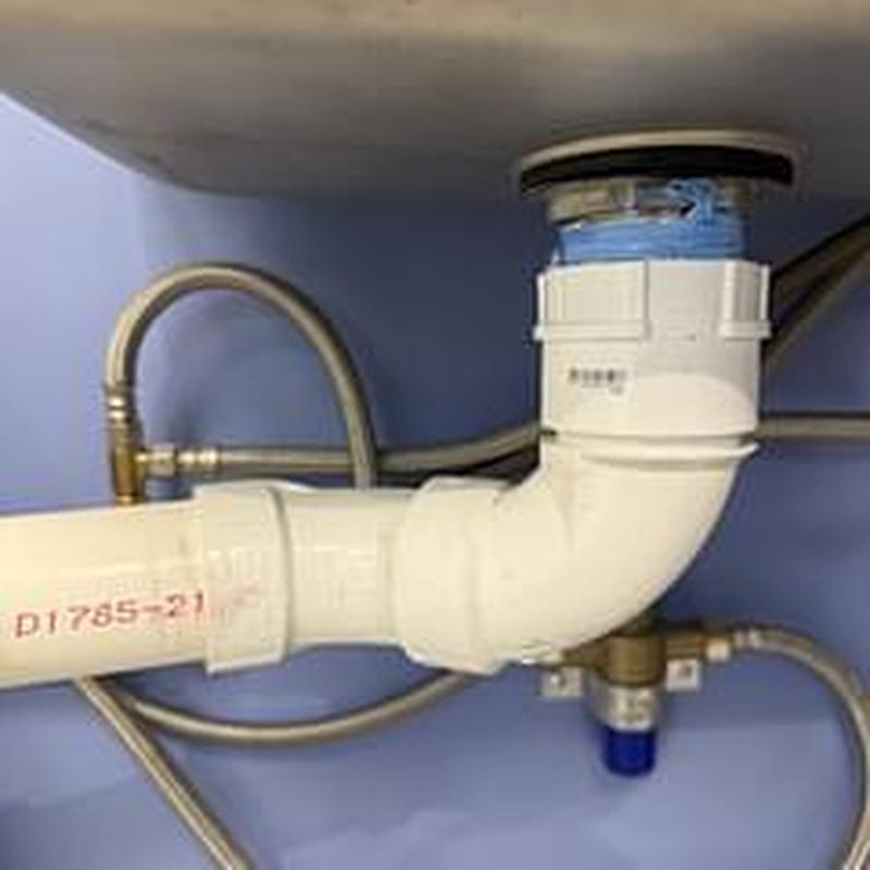 Basket strainer and PVC drain pipes under sink