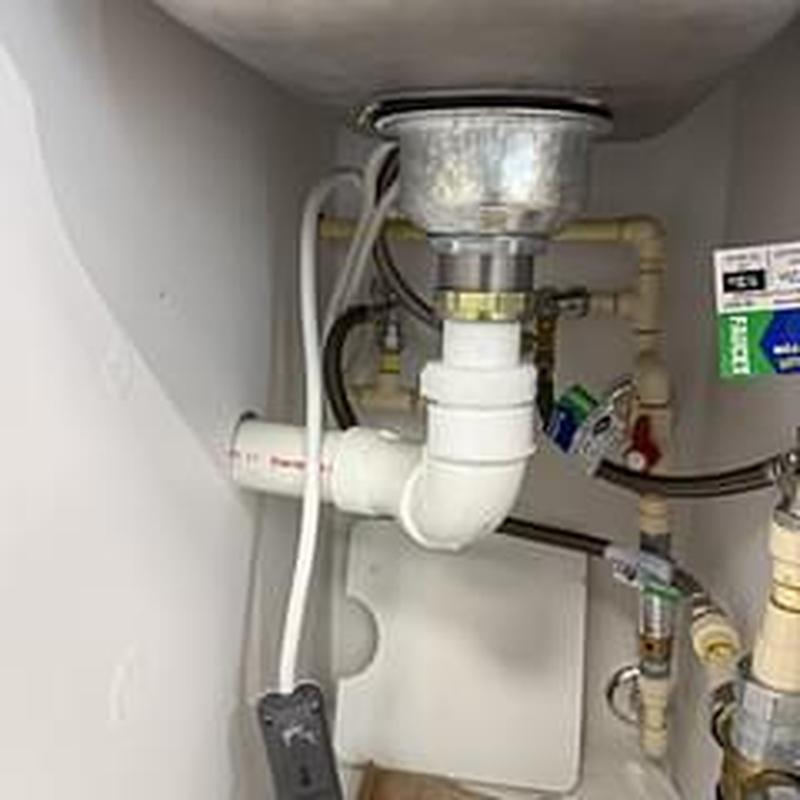 Basket strainer and PVC drain under kitchen sink
