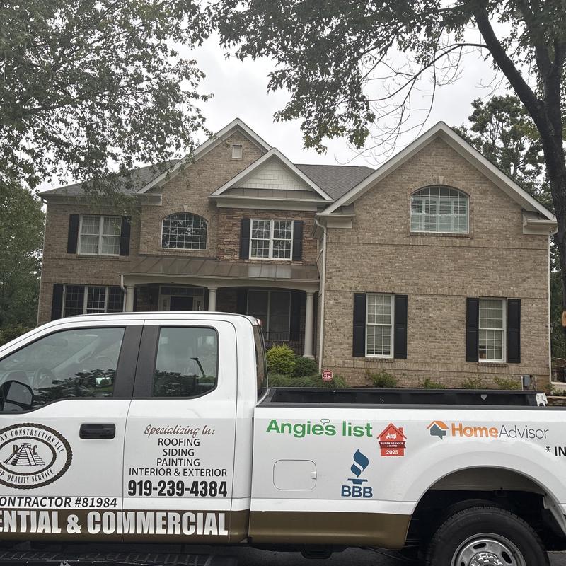 Brick siding and roofing inspection truck in front of house Brick siding and roofing inspection truck in front of house