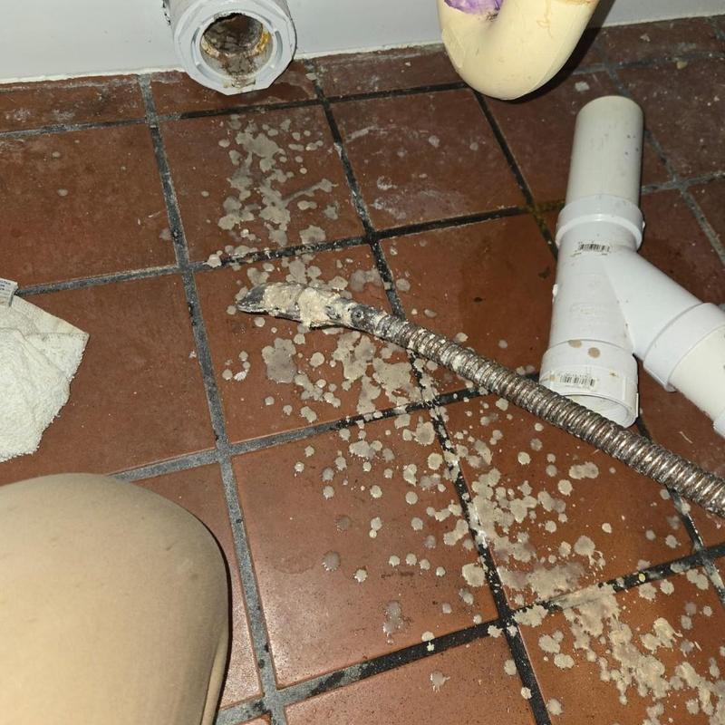 Main drain cable with debris on tiled floor Main drain cable with debris on tiled floor