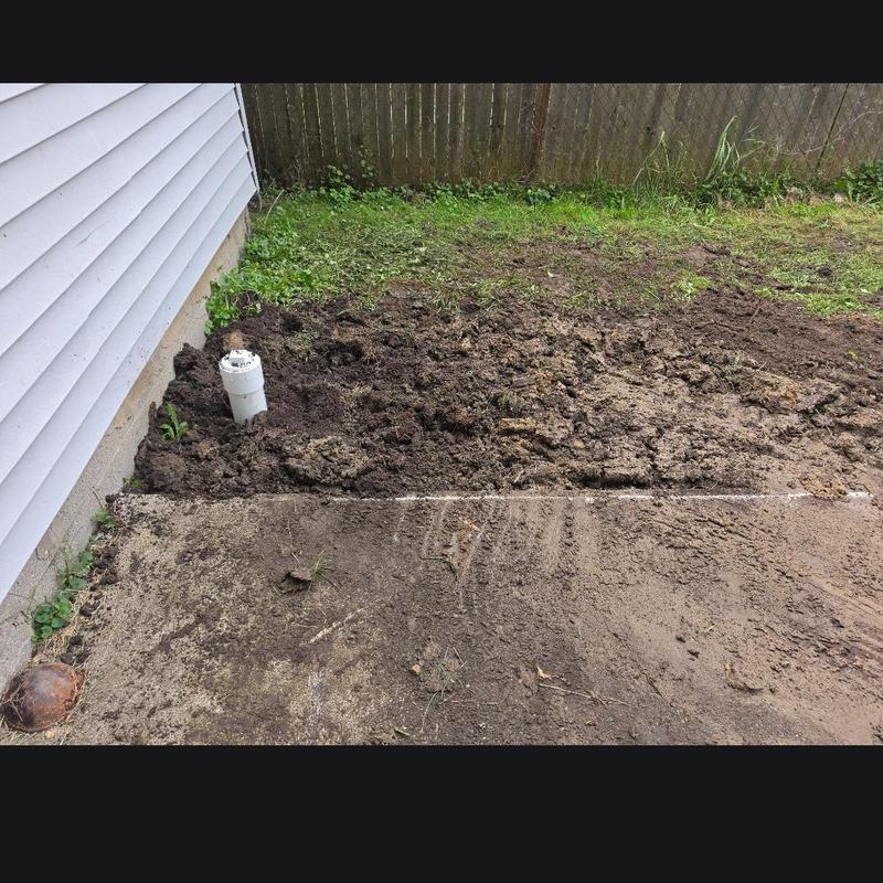 House sewer cleanout pipe installation by house wall House sewer cleanout pipe installation by house wall