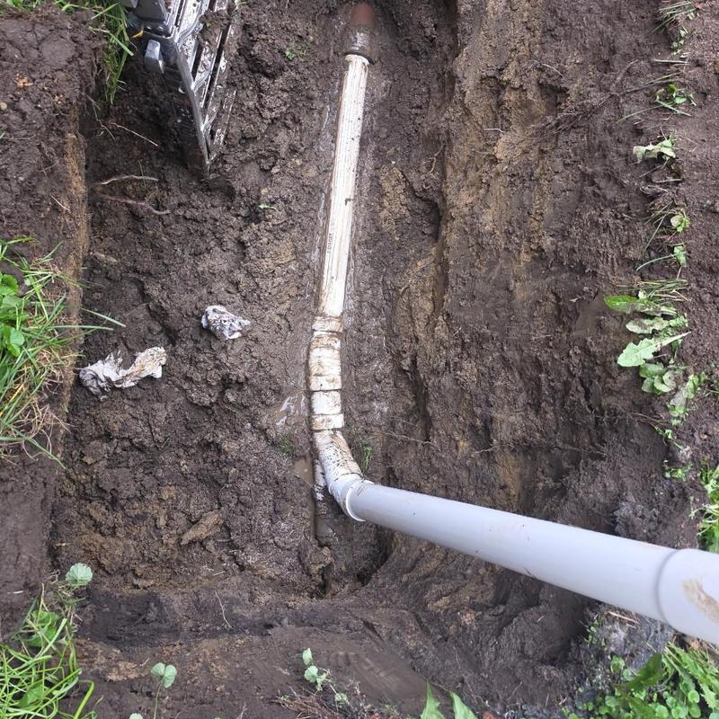House drain pipe with new cleanout installation in soil House drain pipe with new cleanout installation in soil