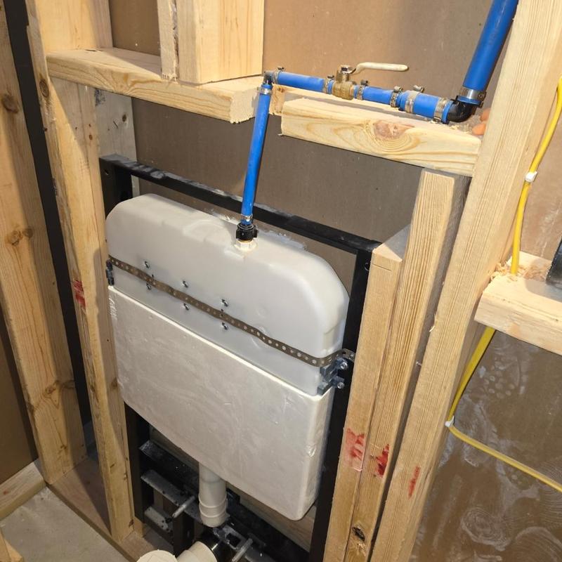 Toilet tank installation with water supply line in framing Toilet tank installation with water supply line in framing