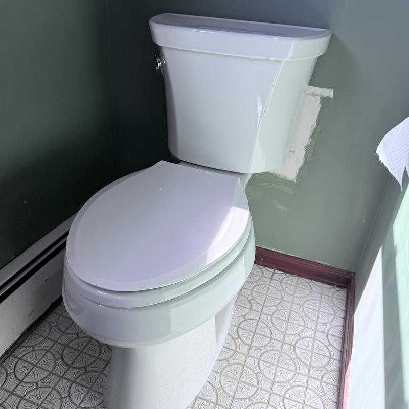 Kohler toilet and flange replacement in bathroom corner Kohler toilet and flange replacement in bathroom corner