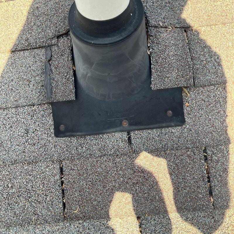 Roof flashing with damaged shingles and lifted granules
