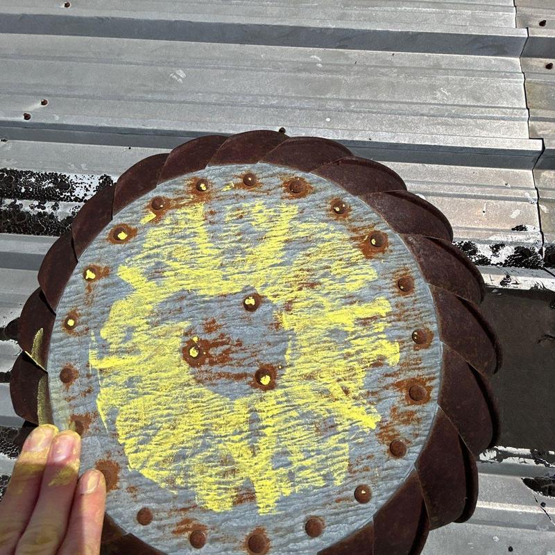 Metal roof panel with rust and corrosion markings