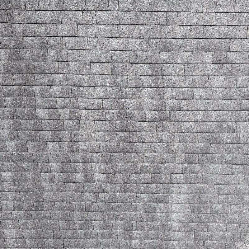 Architectural asphalt roofing shingles with hail damage
