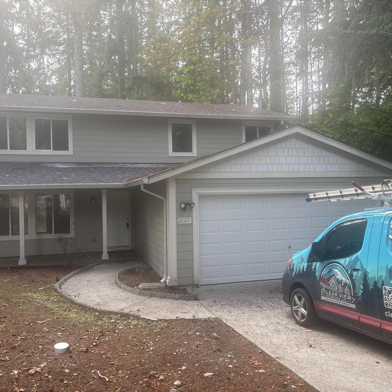 Asphalt shingle roof on two-story home with garage