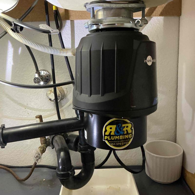Garbage disposal unit installation under sink