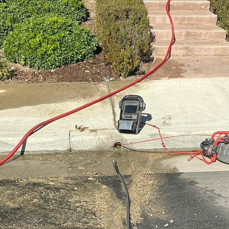 Area drain line with hydro-jetting equipment outdoors