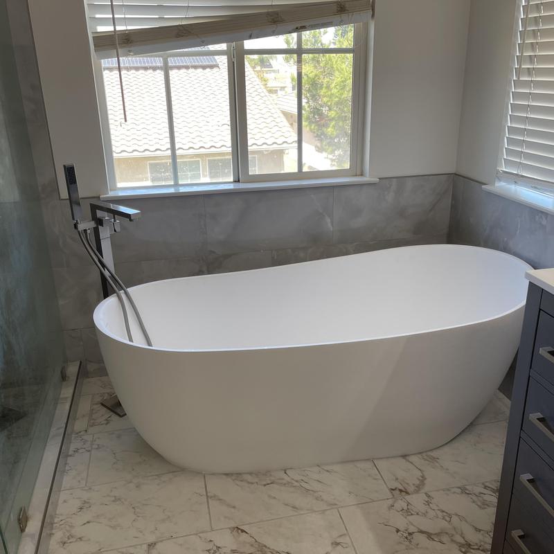 Freestanding bathtub with new brass tailpiece drain