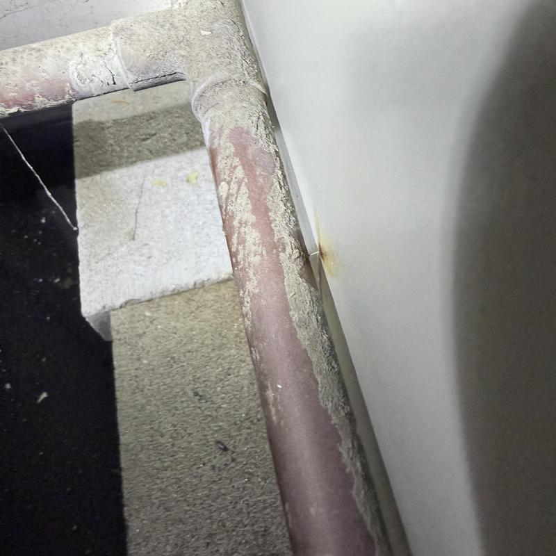 Copper water pipe with corrosion and leak stain Copper water pipe with corrosion and leak stain