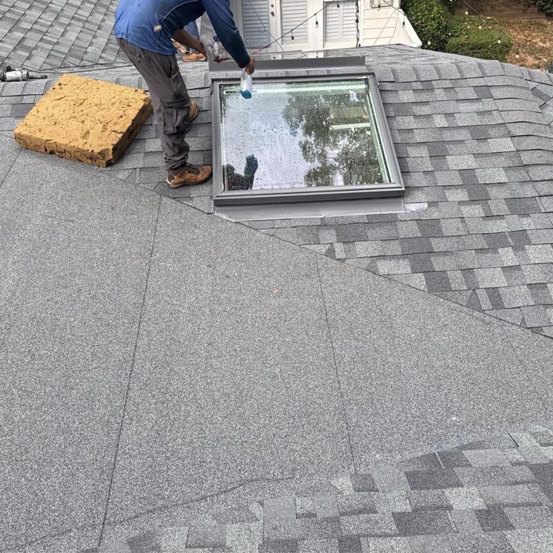 Skylight installation on roof with asphalt shingles Skylight installation on roof with asphalt shingles
