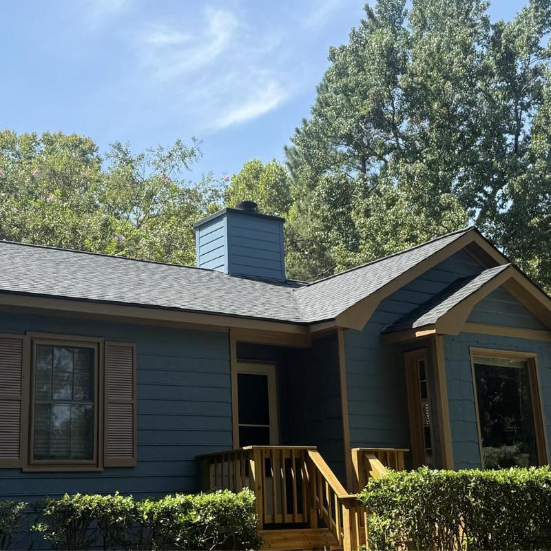 Architectural asphalt shingles roof with chimney flashing Architectural asphalt shingles roof with chimney flashing