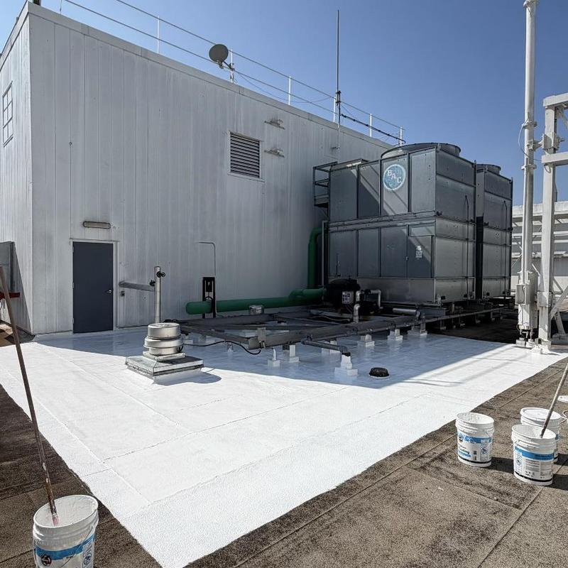 Flat roof coating around cooling towers and drains Flat roof coating around cooling towers and drains