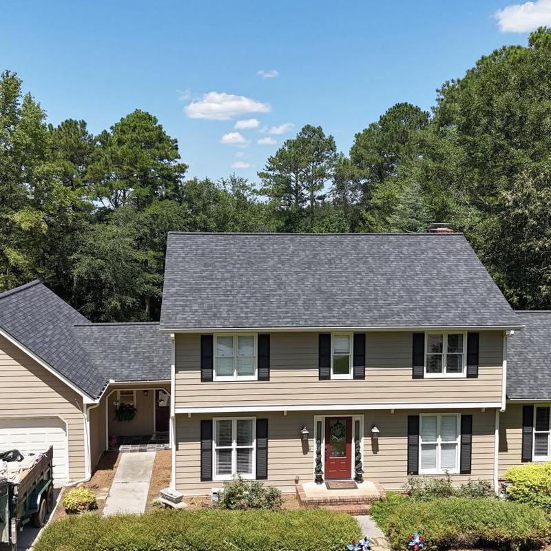 Architectural asphalt shingle roof on two-story home Architectural asphalt shingle roof on two-story home
