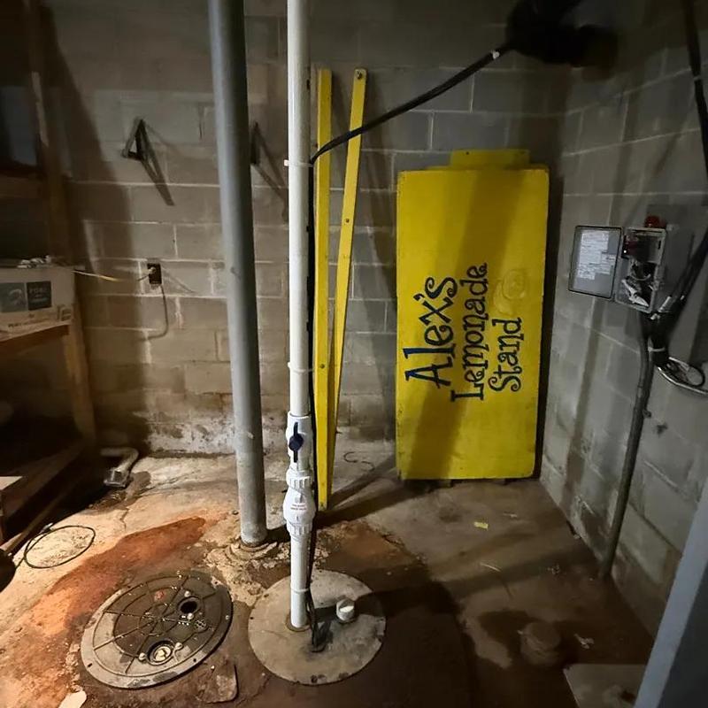 Sewer ejector pump and sump basin installation in basement