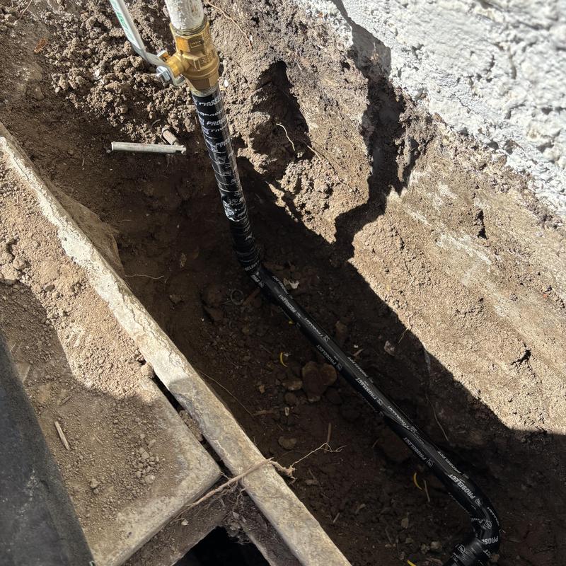 Gas line with new brass valve installed in trench Gas line with new brass valve installed in trench