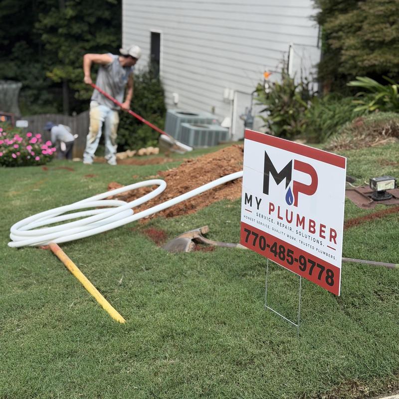 Main water line installation with excavation in yard