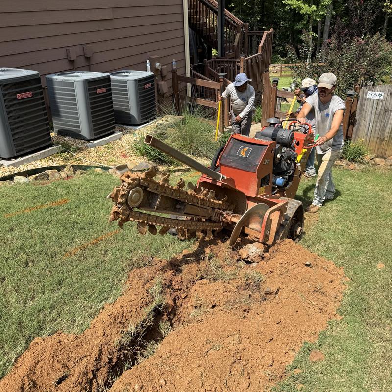 Water main line trenching with excavation machine
