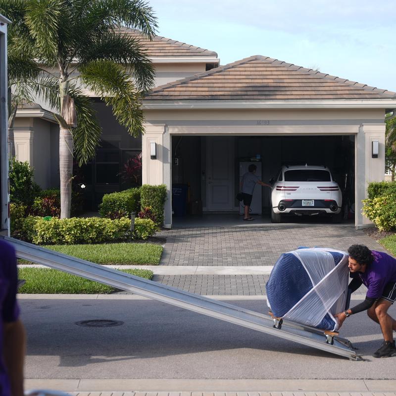 Furniture moving with loading ramp on residential street