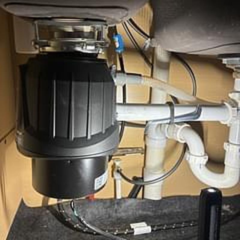 Garbage disposer installation with plumbing connections