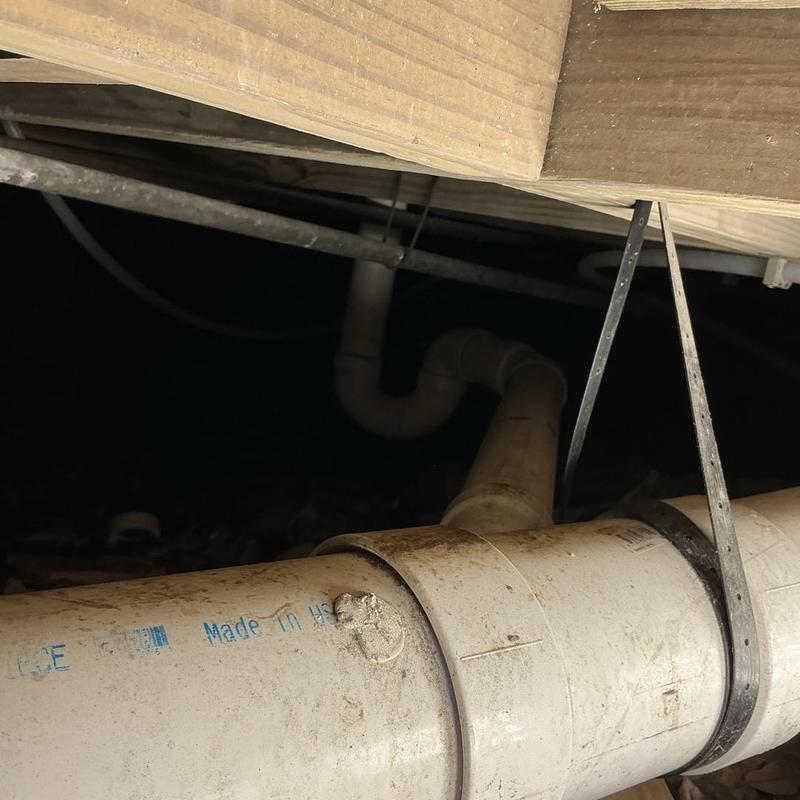 4-inch Fernco coupling on under-house plumbing pipe 4-inch Fernco coupling on under-house plumbing pipe