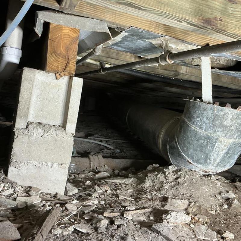 Under-house plumbing and vent pipe inspection with support blocks Under-house plumbing and vent pipe inspection with support blocks