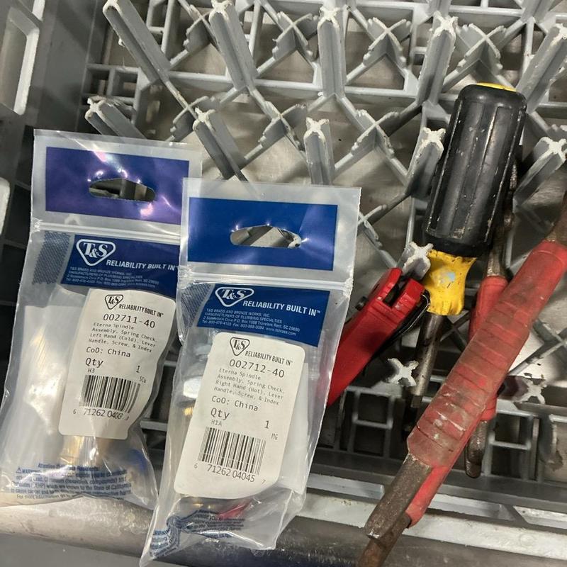 Faucet stem replacement parts with tools on rack Faucet stem replacement parts with tools on rack