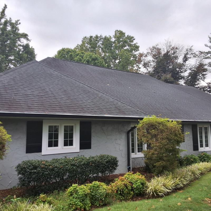 Asphalt shingle roof with signs of premature wear