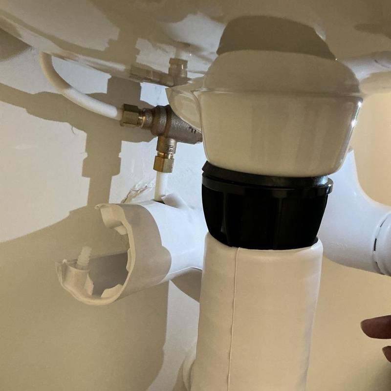 Sink drain trap with broken pipe connector under sink Sink drain trap with broken pipe connector under sink