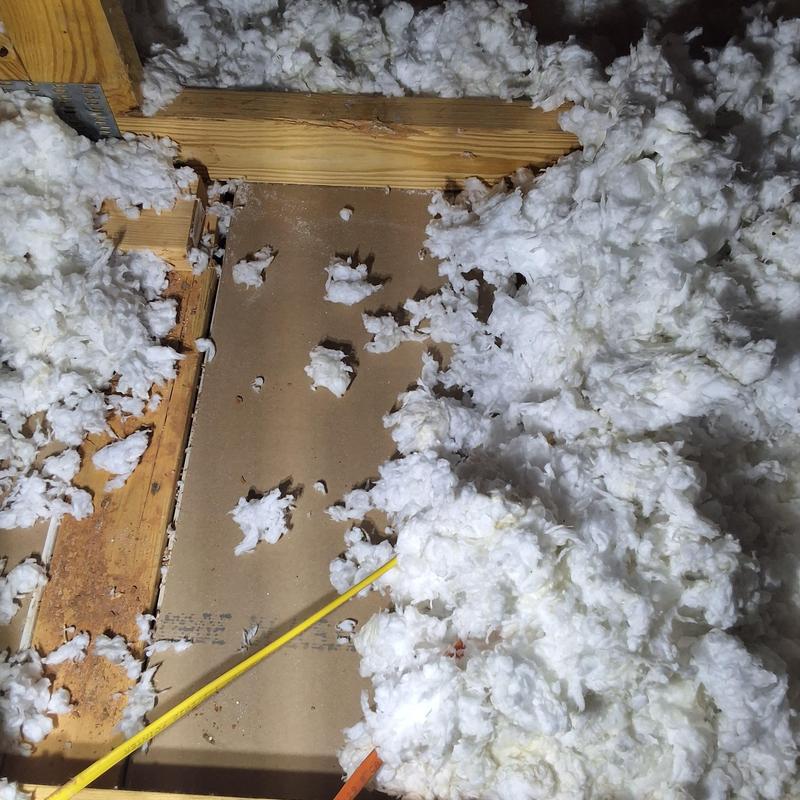 Attic insulation with water damage inspection in progress Attic insulation with water damage inspection in progress