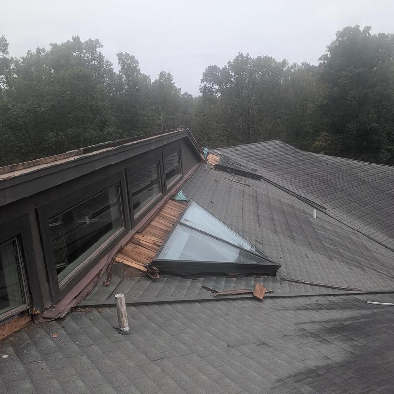 Velux commercial skylights with storm damage on roof