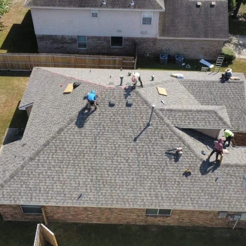 Architectural shingle roof installation on home Architectural shingle roof installation on home