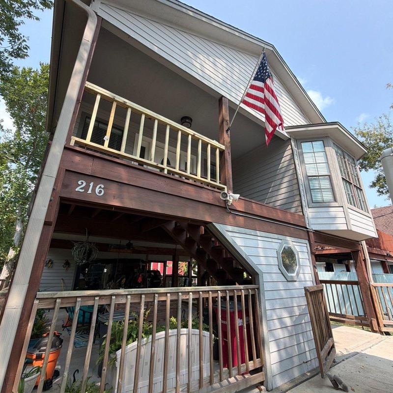 Wood patio railing with sliding gate and drywall repair Wood patio railing with sliding gate and drywall repair