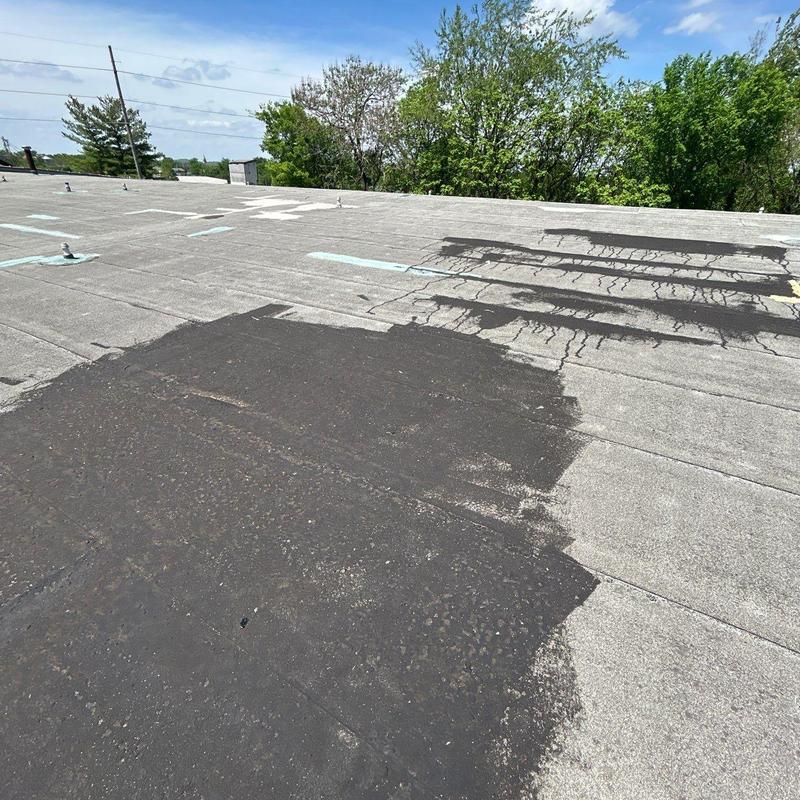 Flat roof membrane damage and repair inspection