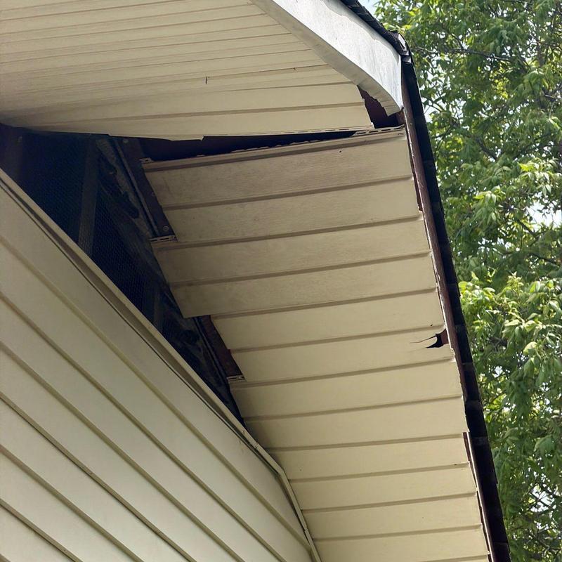 Soffit panels with visible damage and cracks
