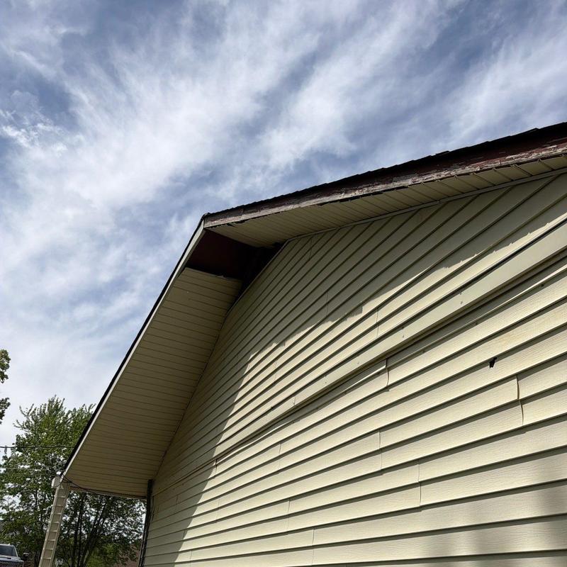 Vinyl siding with visible warping and damage