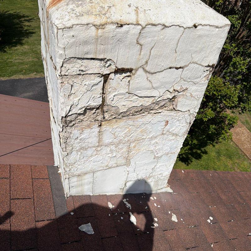 Chimney stucco with severe cracking and damage