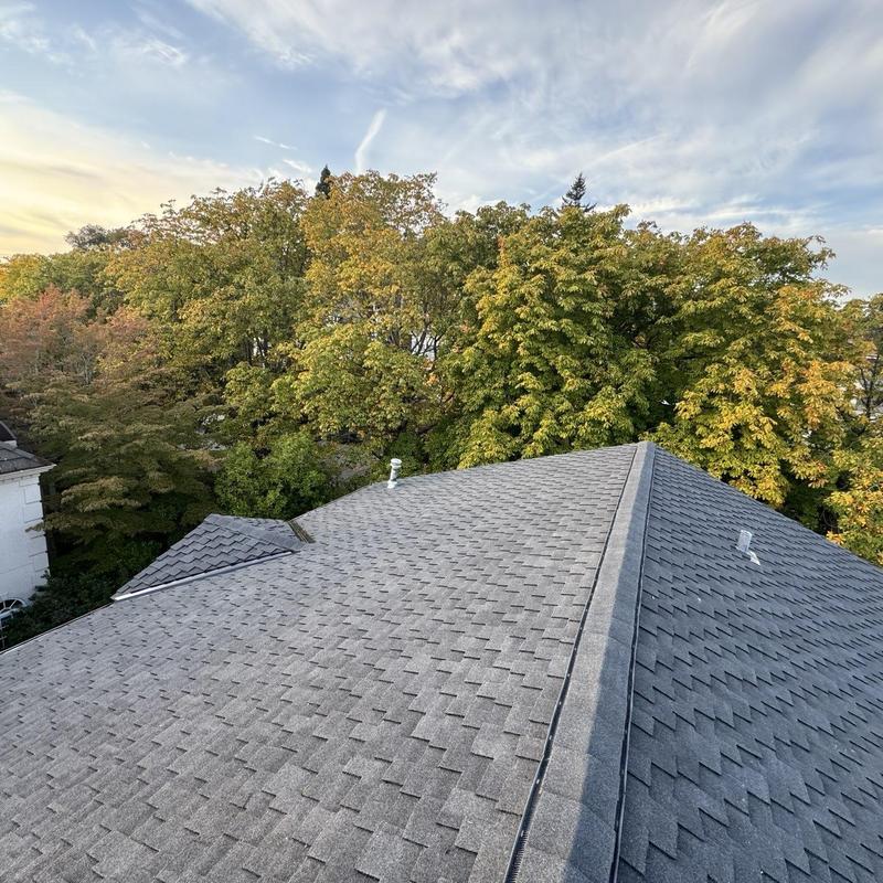 Asphalt shingle roof with ridge cap installation