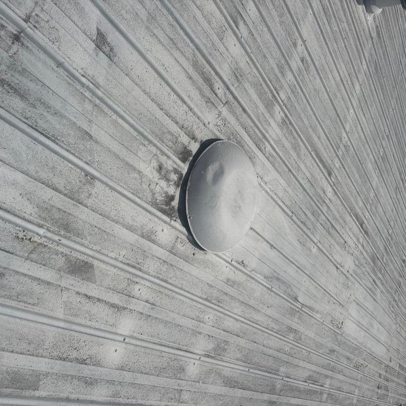 Metal roofing hail damage with vent pipe flashings