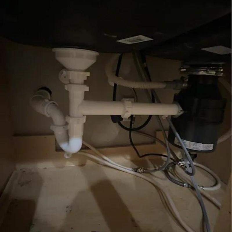 Kitchen sink drain pipes and garbage disposal setup