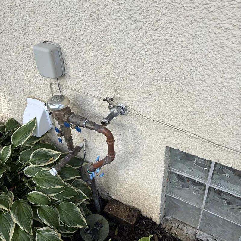 Outdoor water spigot with replaced gasket and piping