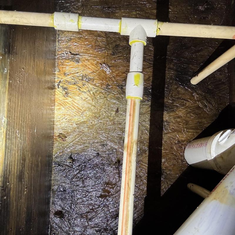 CPVC pipe tee joint with new couplings in crawl space CPVC pipe tee joint with new couplings in crawl space
