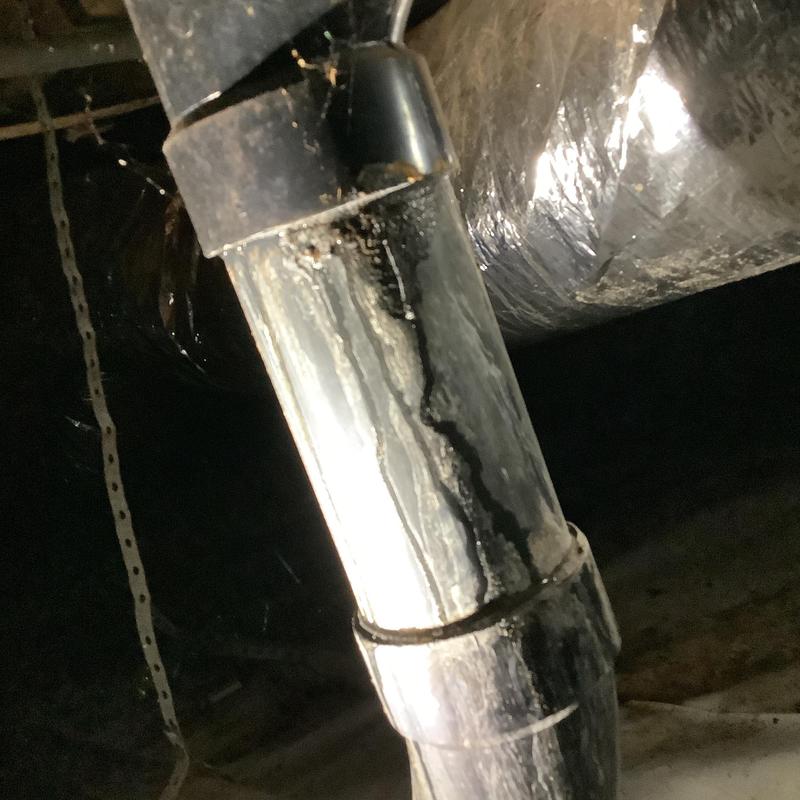 3-inch ABS drain pipe with leak damage in crawl space 3-inch ABS drain pipe with leak damage in crawl space