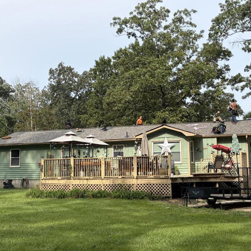 Architectural asphalt shingle roof installation on single-story home Architectural asphalt shingle roof installation on single-story home