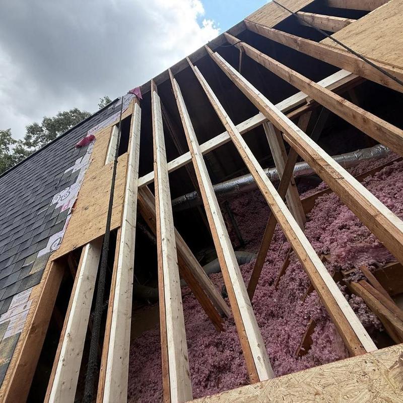 Roof rafters and decking with insulation in roof repair Roof rafters and decking with insulation in roof repair