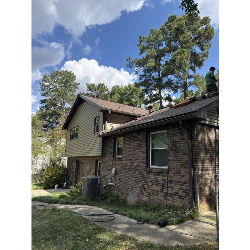 Asphalt shingle roof installation on split-level home Asphalt shingle roof installation on split-level home