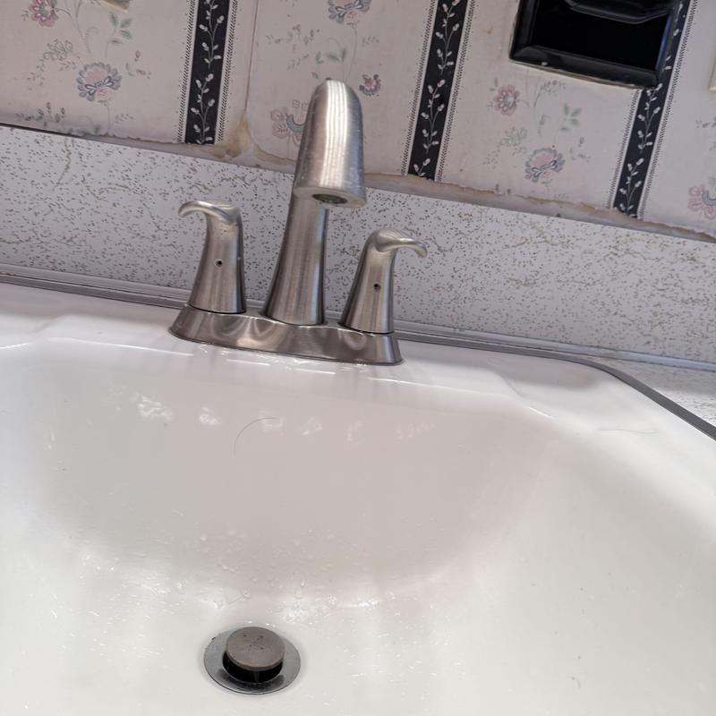 Faucet drain and sink with new fixtures installed Faucet drain and sink with new fixtures installed